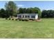 Beautiful curb appeal of this well-maintained home and landscaped yard, showcasing its charm and inviting atmosphere at 6219 Heavner Rd, Vale, NC 28168