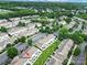 An aerial shot showcasing the community pool, clubhouse, and surrounding neighborhood with mature trees and well-maintained landscaping at 635 Brickdust Ct, Fort Mill, SC 29708