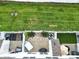 A bird's eye view of the backyard with white fencing, manicured lawn, and an outdoor dining set at 635 Brickdust Ct, Fort Mill, SC 29708