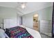 Bedroom view showcasing a large window, neutral carpet, and access to the bathroom at 635 Brickdust Ct, Fort Mill, SC 29708