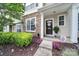Charming townhome entrance featuring an inviting front porch with stylish decor and well-manicured landscaping at 635 Brickdust Ct, Fort Mill, SC 29708
