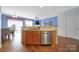 Open kitchen featuring an island with a sink, stainless steel appliances, and a view into the dining area at 635 Brickdust Ct, Fort Mill, SC 29708