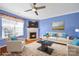 Bright living room with fireplace, neutral furniture, and a large window at 635 Brickdust Ct, Fort Mill, SC 29708