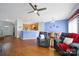 Cozy living room featuring hardwood floors and access to the dining room and kitchen at 635 Brickdust Ct, Fort Mill, SC 29708
