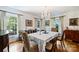 Elegant dining room with chandelier, natural light, and classic decor at 6434 Sardis Rd, Charlotte, NC 28270