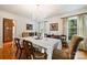 Elegant dining room with chandelier, natural light, and classic decor at 6434 Sardis Rd, Charlotte, NC 28270