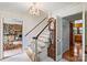 Traditional foyer featuring chandelier, staircase, and view to the living room at 6434 Sardis Rd, Charlotte, NC 28270