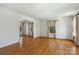 Bright living room with hardwood floors and large windows at 6434 Sardis Rd, Charlotte, NC 28270