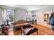Cozy living room with hardwood floors and natural light, featuring fireplace and comfortable seating at 6434 Sardis Rd, Charlotte, NC 28270