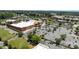 Aerial view of shopping center showing parking lot and building with trees and grass nearby at 6438 Hove Rd, Mint Hill, NC 28227