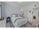 Tranquil bedroom with a patterned accent wall, soft carpet, and bedside table, perfect for relaxation at 6438 Hove Rd, Mint Hill, NC 28227