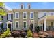 Charming townhome with a landscaped front yard, featuring classic architectural details and a welcoming entrance at 6438 Hove Rd, Mint Hill, NC 28227