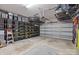 Spacious garage with ample storage solutions featuring shelving units and overhead racks at 6438 Hove Rd, Mint Hill, NC 28227