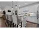 Bright kitchen with white cabinets, stainless steel appliances, an island, and barstool seating at 6438 Hove Rd, Mint Hill, NC 28227