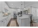 Open kitchen with white cabinets, granite countertops, stainless appliances, and a spacious island at 6438 Hove Rd, Mint Hill, NC 28227