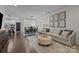 Inviting living room features an open floor plan, dining area, and cozy seating area with decor at 6438 Hove Rd, Mint Hill, NC 28227