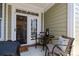 Inviting outdoor patio with comfortable seating, perfect for relaxing and entertaining with a view of the kitchen at 6438 Hove Rd, Mint Hill, NC 28227