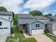 Aerial view showcasing a home with a garage, deck, and well-maintained landscaping at 647 R L Stowe Rd, Belmont, NC 28012