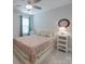 Bedroom features a decorative mirror, side tables, and an abundance of natural light at 647 R L Stowe Rd, Belmont, NC 28012