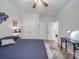 Bright bedroom with hardwood floors, ceiling fan and white trim at 647 R L Stowe Rd, Belmont, NC 28012