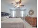 Bright bedroom with a ceiling fan, a dresser, and a decorative window at 647 R L Stowe Rd, Belmont, NC 28012
