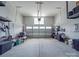 Spacious garage with ample storage and a large overhead door for easy access at 647 R L Stowe Rd, Belmont, NC 28012