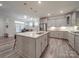 Bright kitchen features granite countertops, stainless steel appliances, and a kitchen island at 647 R L Stowe Rd, Belmont, NC 28012