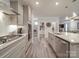 Modern kitchen features stainless appliances, including a gas cooktop, with gray cabinets and beautiful countertops at 647 R L Stowe Rd, Belmont, NC 28012