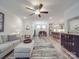 Open-concept living area with wood floors and seamlessly connects the living room, dining area, and kitchen at 647 R L Stowe Rd, Belmont, NC 28012