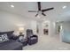 This living room features neutral paint, a ceiling fan, and comfortable seating at 647 R L Stowe Rd, Belmont, NC 28012