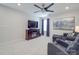 Cozy living room with dark wood entertainment center, wall-mounted TV, and comfortable seating at 647 R L Stowe Rd, Belmont, NC 28012