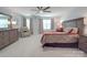 Comfortable main bedroom with a ceiling fan, dresser, and ample natural light at 647 R L Stowe Rd, Belmont, NC 28012