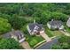 Aerial view of a charming home nestled among lush greenery, showcasing its attractive landscaping and neighborhood setting at 6632 Hawksnest Dr, Charlotte, NC 28269