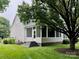 The home features a screened porch, new stairs, and a well-maintained lawn with mature trees at 6632 Hawksnest Dr, Charlotte, NC 28269