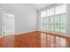 Bright bedroom with hardwood floors, white trim, and plenty of natural light at 6632 Hawksnest Dr, Charlotte, NC 28269