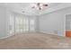 Bright bedroom with neutral color palette, tray ceiling, and large bay window at 6632 Hawksnest Dr, Charlotte, NC 28269