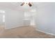 Bright bonus room featuring neutral walls, ceiling fan, and plush carpeting at 6632 Hawksnest Dr, Charlotte, NC 28269