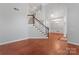 Spacious foyer with hardwood floors, a staircase, and elegant lighting fixtures, creating a grand entrance at 6632 Hawksnest Dr, Charlotte, NC 28269
