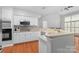 Spacious kitchen features an island, stainless steel appliances, and white cabinets at 6632 Hawksnest Dr, Charlotte, NC 28269