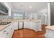 Bright kitchen featuring wood floors, stainless steel appliances and light countertops at 6632 Hawksnest Dr, Charlotte, NC 28269