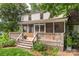 Inviting backyard featuring a spacious deck, screened-in porch, and lush landscaping at 7213 Lancer Dr, Charlotte, NC 28226