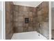 The bathroom has a shower with brown tile and a built in niche at 7213 Lancer Dr, Charlotte, NC 28226
