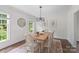 Cozy dining area with natural light from the large windows, ideal for intimate meals at 7213 Lancer Dr, Charlotte, NC 28226