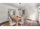 Elegant dining room with rustic table and chairs, perfect for Gathering gatherings and dinner parties at 7213 Lancer Dr, Charlotte, NC 28226