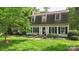 Charming home exterior with a well-manicured lawn and tasteful landscaping at 7213 Lancer Dr, Charlotte, NC 28226