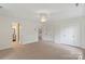 The spacious bedroom has carpet, ceiling fan, and ample closet space at 7213 Lancer Dr, Charlotte, NC 28226