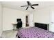 Bedroom with carpet, desk, ceiling fan, and ample storage; the door leads to the laundry room at 7434 Dover Mill Sw Ln, Concord, NC 28025