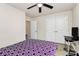 Bedroom with carpet, ceiling fan, large window, and closet providing ample storage and organization options at 7434 Dover Mill Sw Ln, Concord, NC 28025