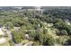 Expansive aerial view of a house nestled among lush trees in a desirable, convenient neighborhood at 747 Saint Michaels Ln # 7, Gastonia, NC 28052