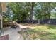 A spacious backyard featuring a deck, patio, firepit, and black fence providing privacy at 747 Saint Michaels Ln # 7, Gastonia, NC 28052